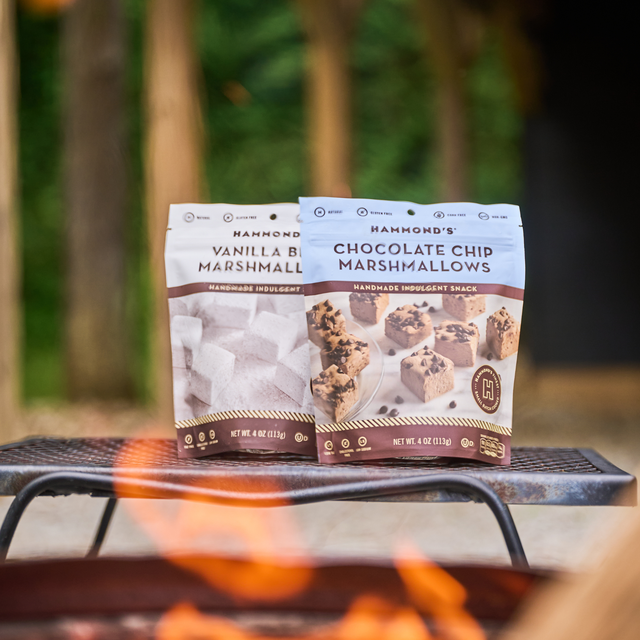 Marshmallow bags sit on bench by bonfire