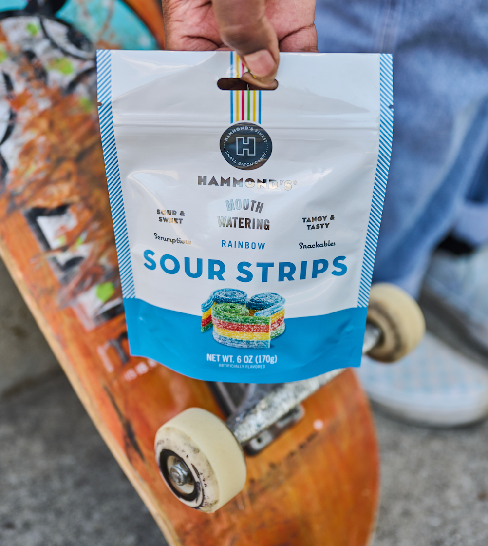 Rainbow Sour Strips on Skateboard