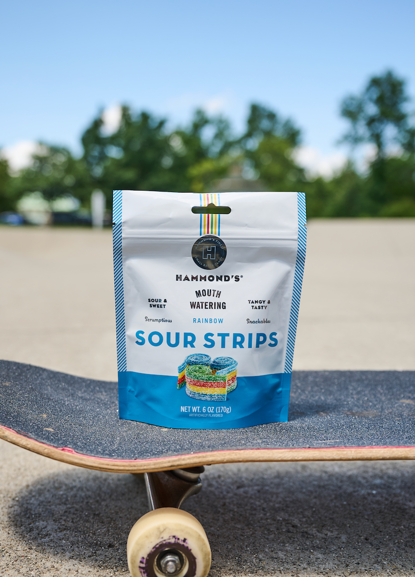 Rainbow Sour Strips on Skateboard