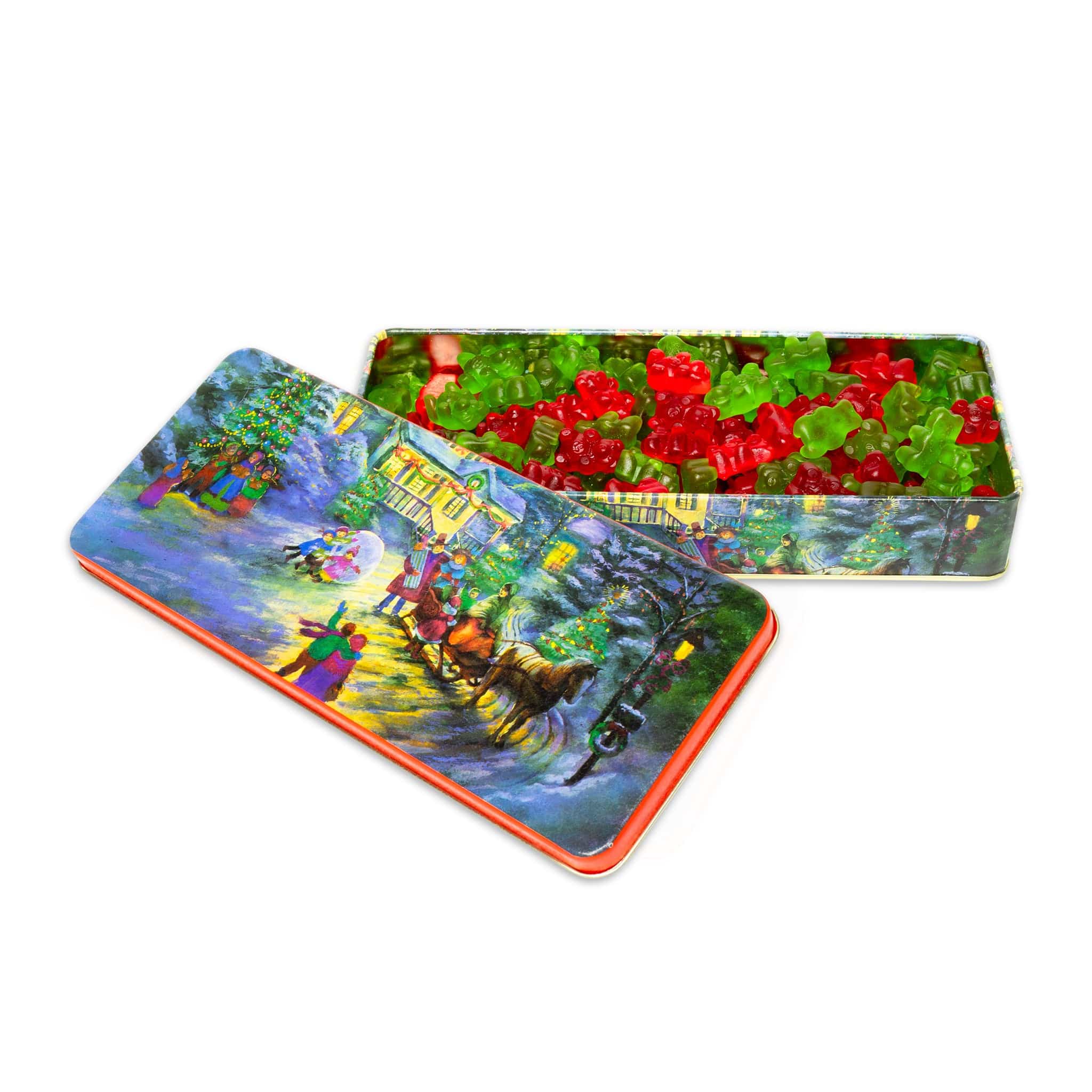 Christmas tin with festive designs with red and green gummies on a white background