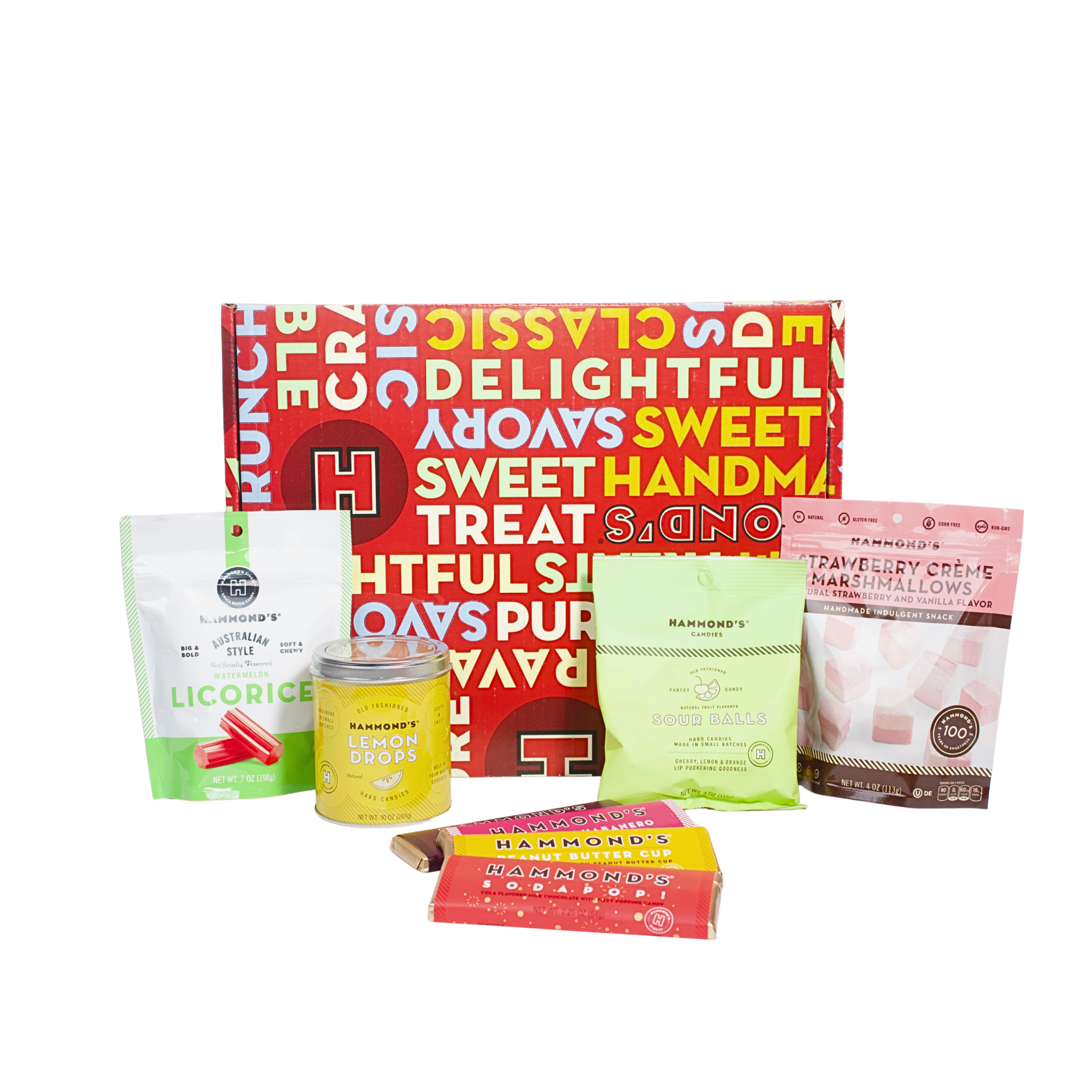 Collection of various snacks and treats with a colorful box in the background on a white background