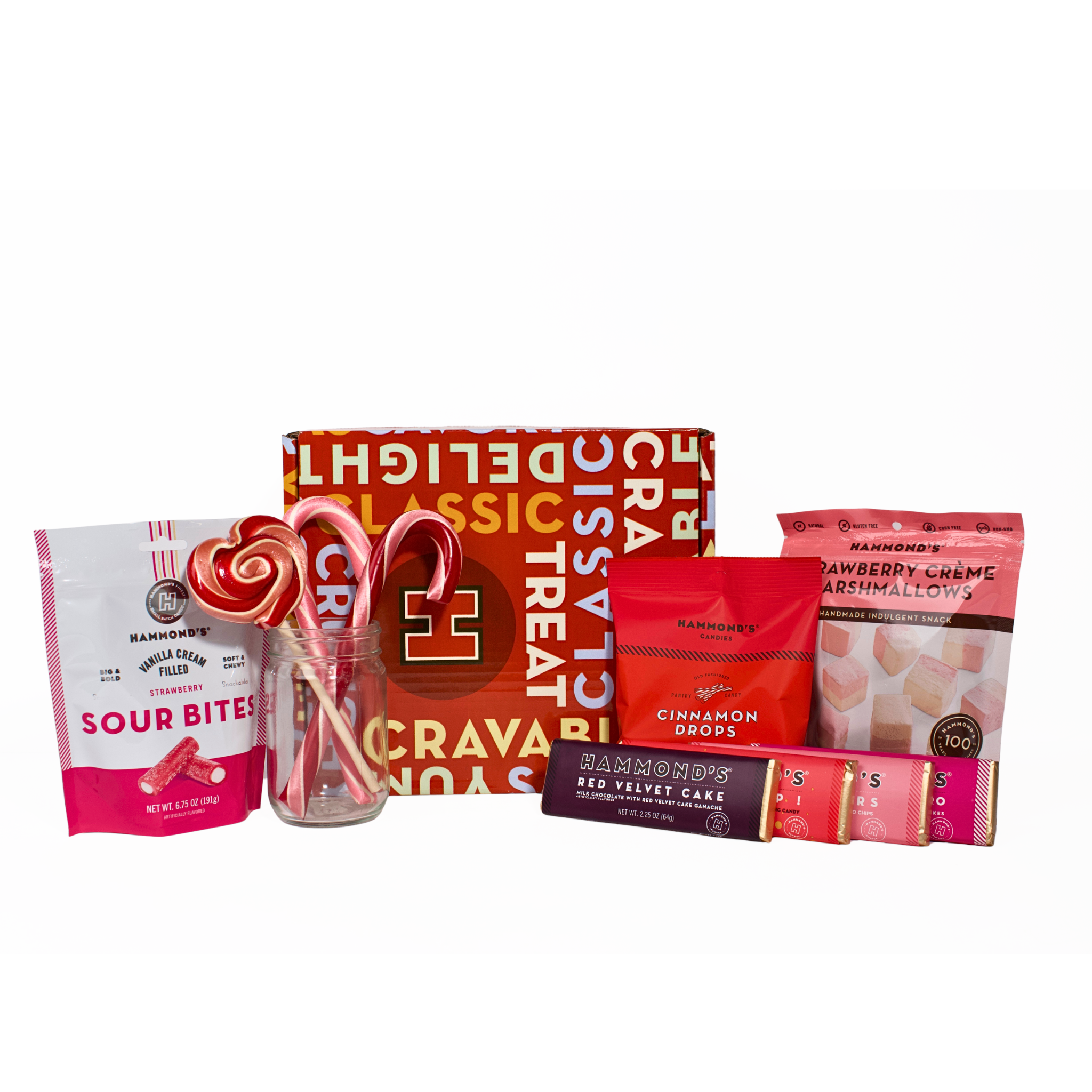 Assorted candy and confectionery items including lollipops, candy canes, and boxes on a white background.