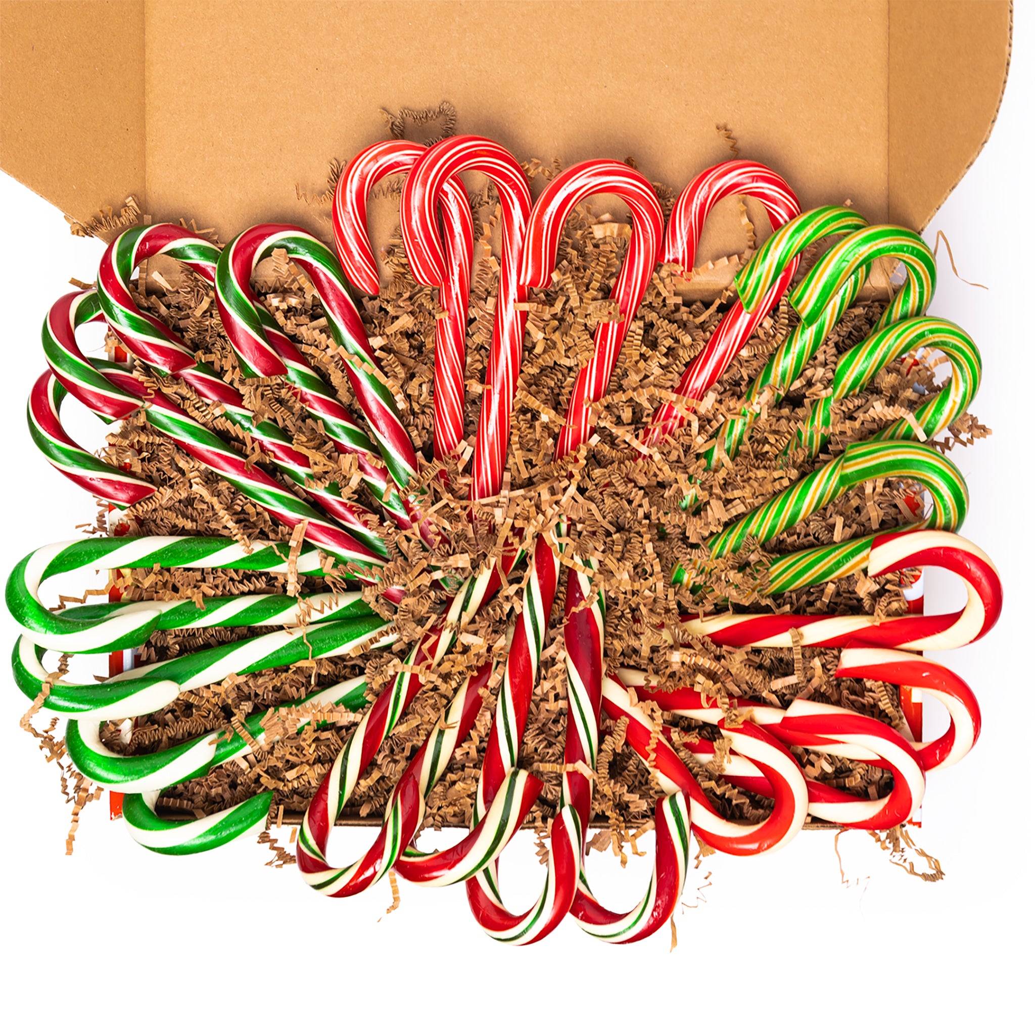 Box of candy canes arranged in a decorative pattern on a white background