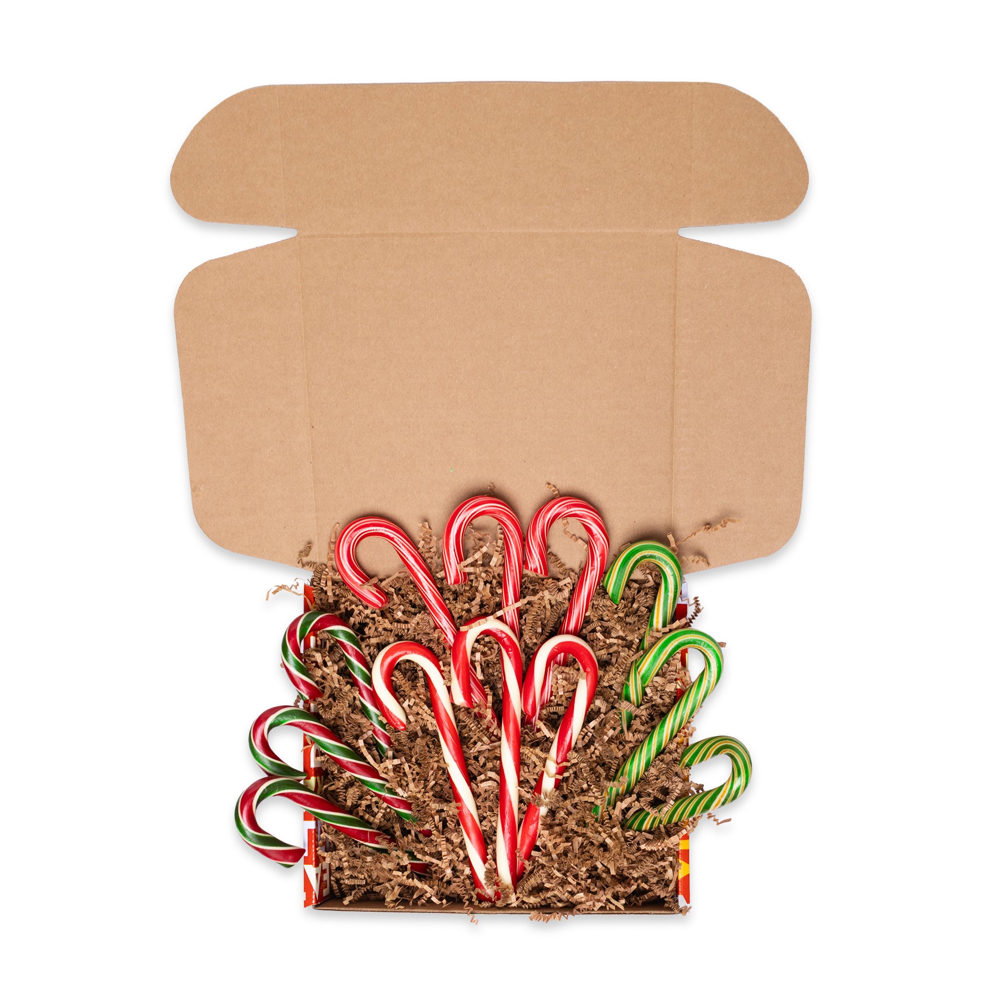 Cardboard box with candy canes on a white background