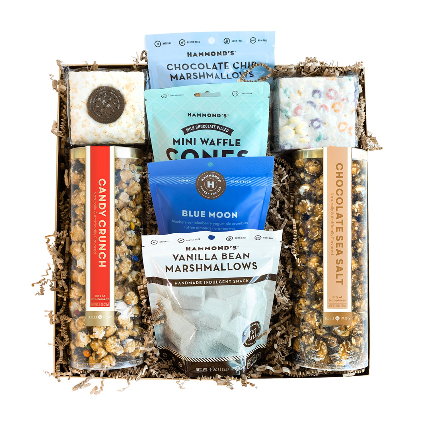 Assorted snack items including marshmallows, waffle cones, and popcorn in a decorative box.