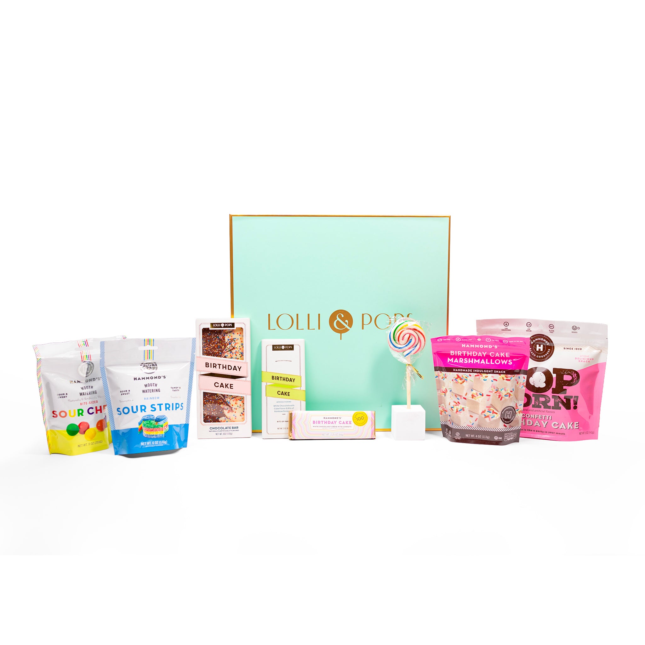 birthday cake goodies from hammonds and lolli and pops in front of green gift box.